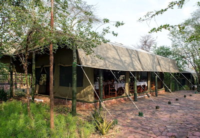 Kirawira Serena Camp Edwardian lounge bar stone terrace firepit Serengeti Tanzania