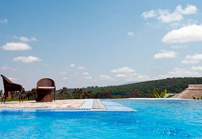 Kitela Lodge famed infinity pool Ngorongoro highlands coffee plantation views Tanzania