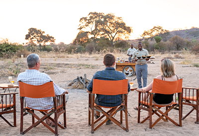 Kwihala Camp sundowners firepit African stars Ruaha National Park Tanzania