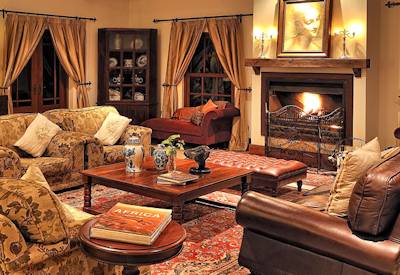 The Manor at Ngorongoro lounge fireplace library billiard room TV room Tanzania