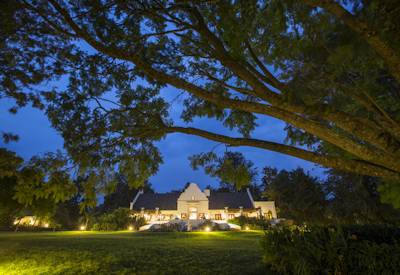 The Manor at Ngorongoro Cape Dutch manor house illuminated night Arabica coffee estate Tanzania