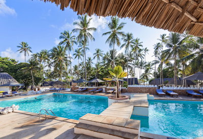 Diamonds Mapenzi Beach Club large recreational pool sun loungers Zanzibar Tanzania