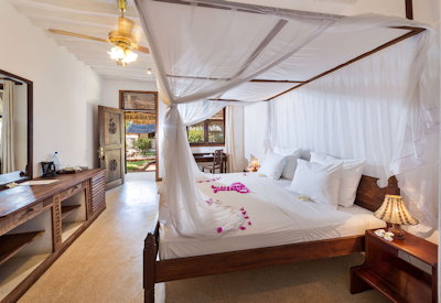 Diamonds Mapenzi Beach Club en-suite bedroom four-poster bed African décor Zanzibar