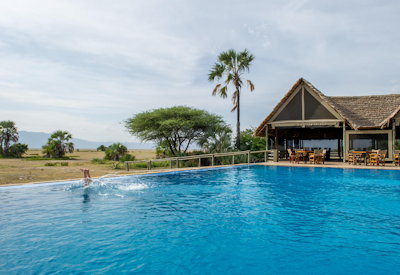 Maramboi Tented Camp large rim-flow swimming pool Lake Manyara views Tanzania