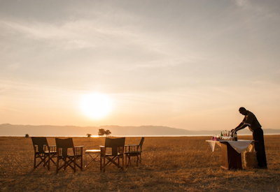 Maramboi Tented Camp sundowner drinks campfire African stars Lake Manyara Tanzania