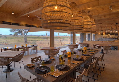 Namiri Plains Camp dining area silver service three-course acacia trees Tanzania