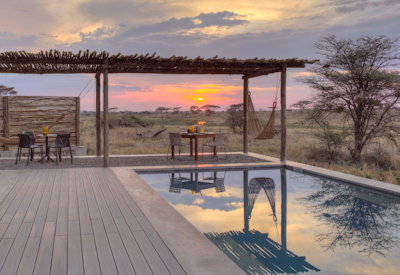 Namiri Plains Camp swimming pool library bar 100% solar Serengeti Tanzania