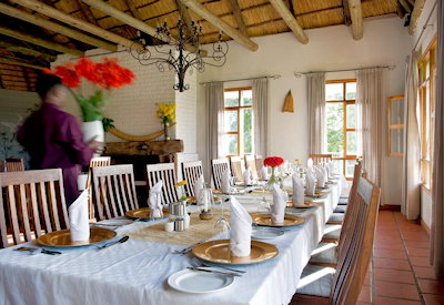 Ngorongoro Farm House indoor dining room 4-course set menu South African wine list Tanzania