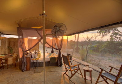 Roho ya Selous large open-sided tented suite king bed fan mosquito netting Tanzania