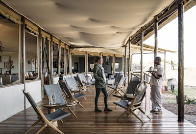 Sanctuary Kusini Camp main mess tent lounge library kopje views Serengeti Tanzania