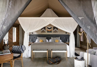 Sanctuary Swala Camp tented suite lavish furnishings private veranda waterhole views Tanzania