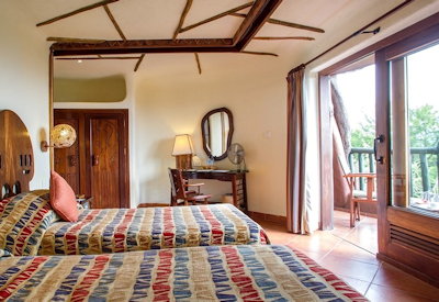 Serengeti Serena Safari Lodge classic suite Mbingwe Valley views rustic African décor Tanzania