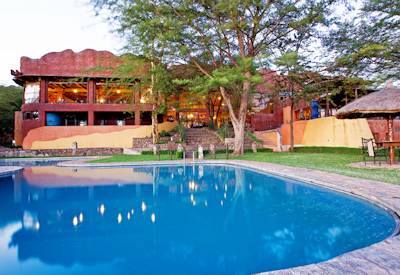 Serengeti Sopa Lodge large swimming pool Serengeti views Nyarboro Hills Tanzania