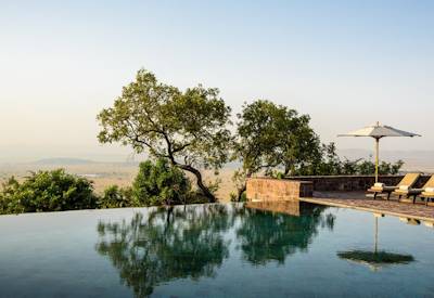 Singita Sasakwa Lodge swimming pool tennis courts Sasakwa Hill Grumeti Tanzania