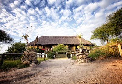 Mbali Mbali Tarangire River Camp elevated candlelit thatched timber dining Tarangire Tanzania