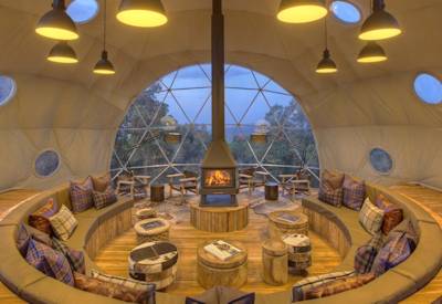 The Highlands Ngorongoro unique lounge indoor fireplace library views Tanzania Asilia