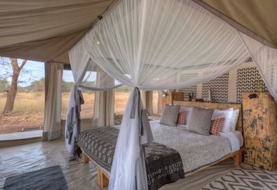 Ubuntu Migration Camp beautifully appointed bedroom traditional East African safari Tanzania
