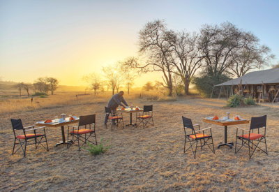 Ubuntu Migration Camp sweeping Serengeti plains views mobile tented camp Tanzania