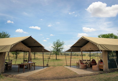 Ubuntu Migration Camp open-plan mess tent lounge dining campfire library Tanzania