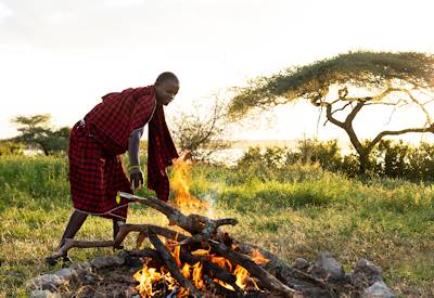 Bush dinner under stars tented camp Taste of Tented Safari Tanzania