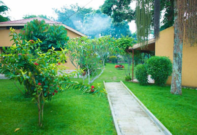 Airport Guesthouse Entebbe rooms overlooking manicured lawns shady trees Uganda