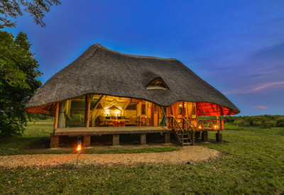 Bakers Lodge shady trees wetlands birdlife Nile riverbank Murchison Falls Uganda