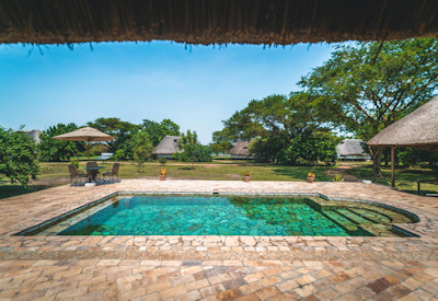 Bakers Lodge refreshing swimming pool lush greenery Nile River views Uganda