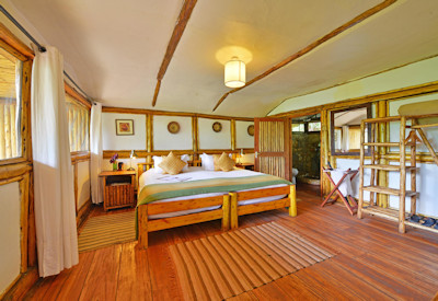 Buhoma Lodge large chalet comfortable bed eco-friendly solar lighting Uganda