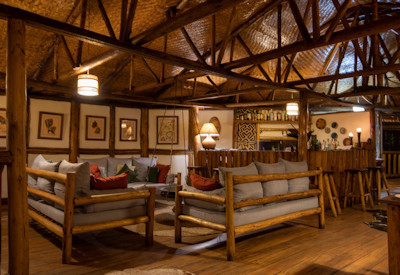 Buhoma Lodge elevated central lounge bar earth tones Bwindi Uganda