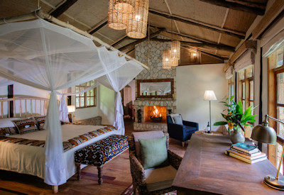 Volcanoes Bwindi Lodge luxury thatched banda private terrace Bwindi Uganda