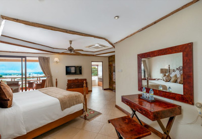 Chobe Safari Lodge luxury cottage twin double bedroom living area butler Uganda