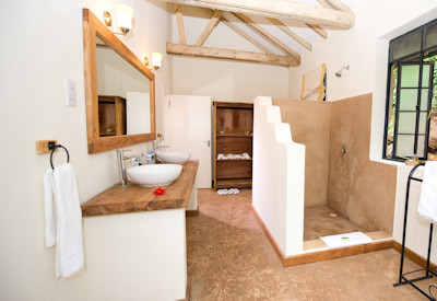 Clouds Mountain Gorilla Lodge en-suite walk-in shower stone cottage Uganda
