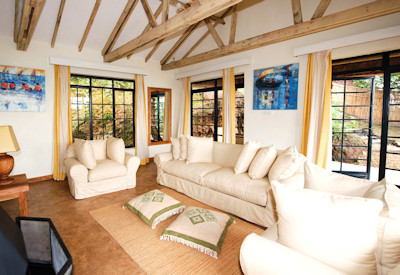 Clouds Mountain Gorilla Lodge lounge blazing fireplace high ceilings Uganda