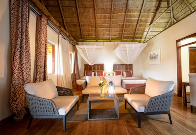 Crater Safari Lodge luxury thatched chalet wooden balcony hammock Kibale Uganda