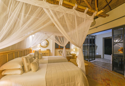 Elephant Plains Lodge luxurious thatched cottage private veranda Uganda