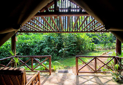 Kibale Forest Camp lush colourful garden veranda colobus monkeys Kibale Uganda