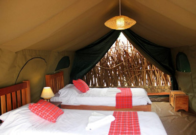 Kidepo Savannah Lodge tented suite Karamajong design colourful blankets Kidepo Uganda