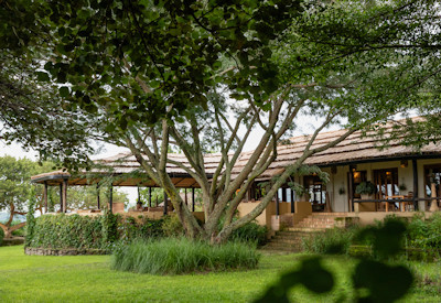 Kyambura Gorge Lodge manicured lawns gardens Kyambura Gorge views Uganda
