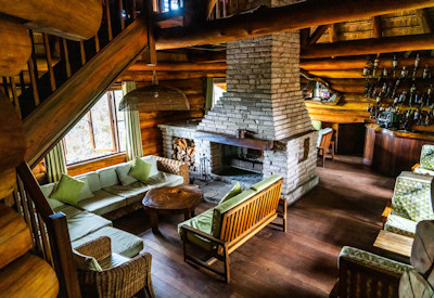 Kyaninga Lodge indoor seating view deck Lake Kyaninga crater views Uganda