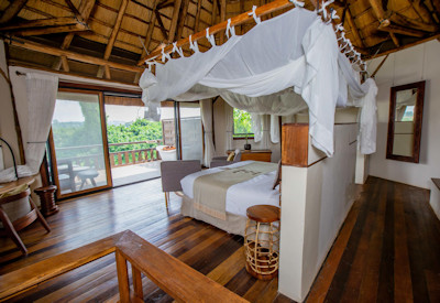 Lemala Wildwaters Lodge thatched suite handcrafted furniture rainforest Uganda