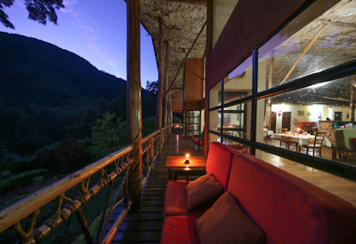 Mahogany Springs Lodge outdoor lounge garden river views Bwindi Uganda