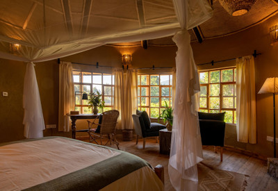 Mount Gahinga Lodge luxury banda double twin bed Bufimbira design Uganda