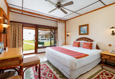 Mweya Safari Lodge beautifully appointed bedroom local artwork Queen Elizabeth Uganda