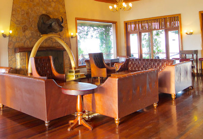 Mweya Safari Lodge central lounge fireplace Kazinga Channel views Uganda