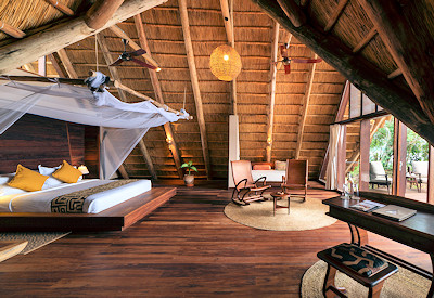 Nile Safari Lodge thatched luxury banda day bed mosquito net Murchison Falls Uganda