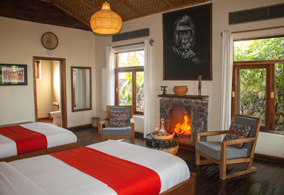 Nkuringo Bwindi Gorilla Lodge twin bedded room fireplace Bwindi Uganda