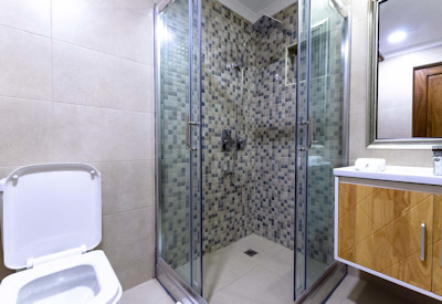 Hotel No.5 lovely en-suite bathroom shower in-room safe WiFi Entebbe Uganda