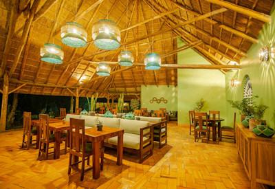 Primate Lodge Kibale thatched dining room international African dishes Kibale Uganda