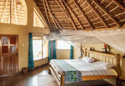 Rwakobo Rock Lodge large spacious thatched cottage solar lighting Lake Mburo Uganda