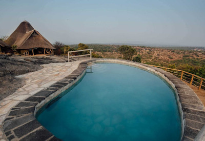 Rwakobo Rock Lodge pool overlooking wilderness Nshara ranch Lake Mburo Uganda
